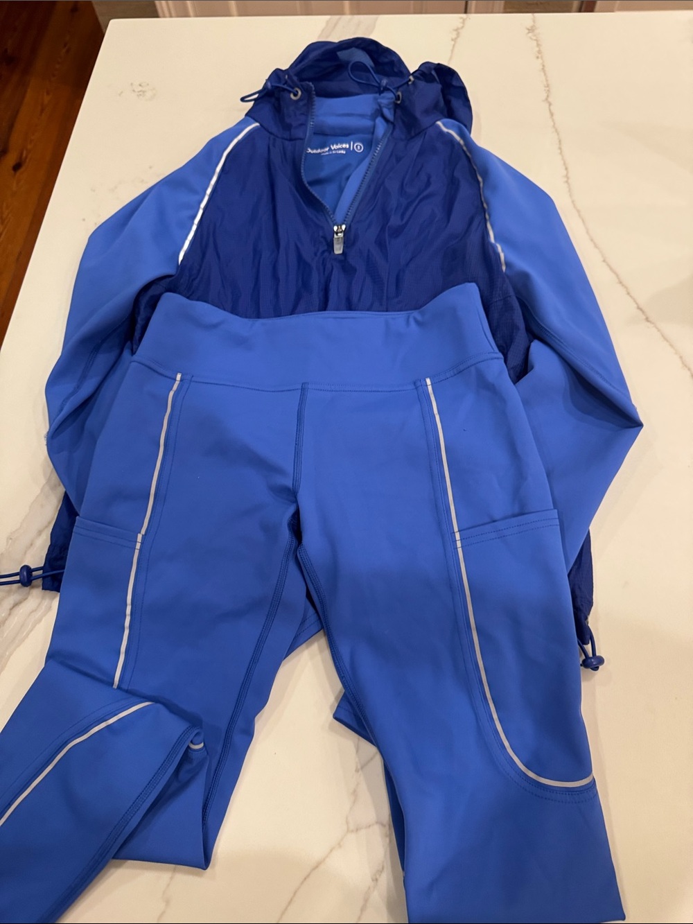 Outdoor Voices Blue Performance Leggings with Reflective Trim and hooded jacket